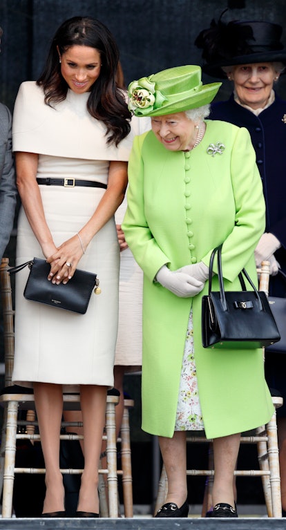 Meghan Markle wore an off-the-shoulder dress from Givenchy for a visit to Cheshire with the Queen in...