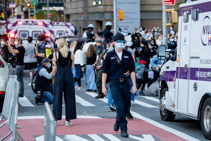 A street full of people with masks because of coronavirus