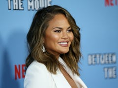 Chrissy Teigen's tweets about Alison Roman clapped back for dissing her cooking empire.