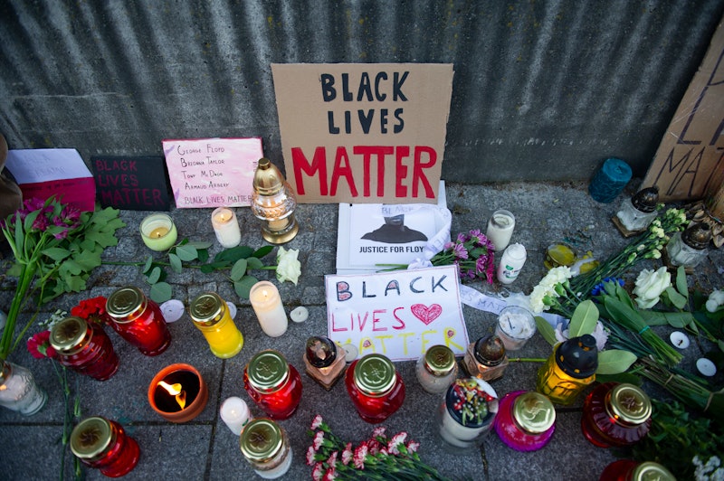 Signs and candles at a Black Lives Matter vigil. Before you go to a protest or share your footage fr...