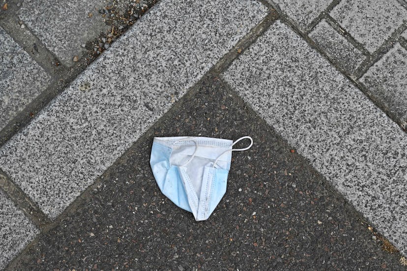 A discarded face mask on the ground. How To Talk To Somebody Who Refuses To Wear A Face Mask, Accord...