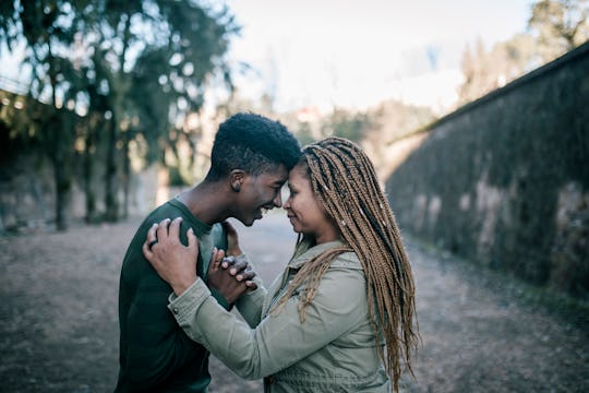 black mom and son hugging
