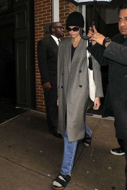 Kaia Gerber in a gray Fendi coat and black Birkenstocks.