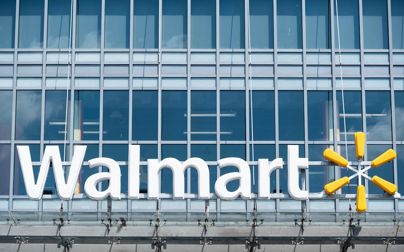 Glass storefront featuring Walmart name and logo