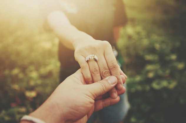 a couple holding hands in an article about signs your marriage will survive infidelity