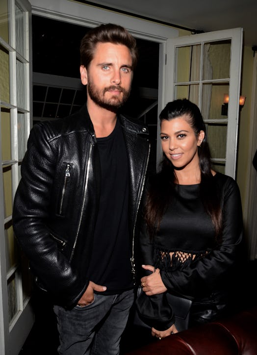Scott Disick and Kourtney Kardashian pose for a photo together.