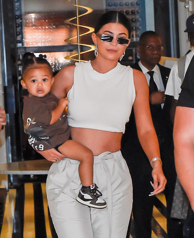 Kylie Jenner steps out with daughter Stormi.