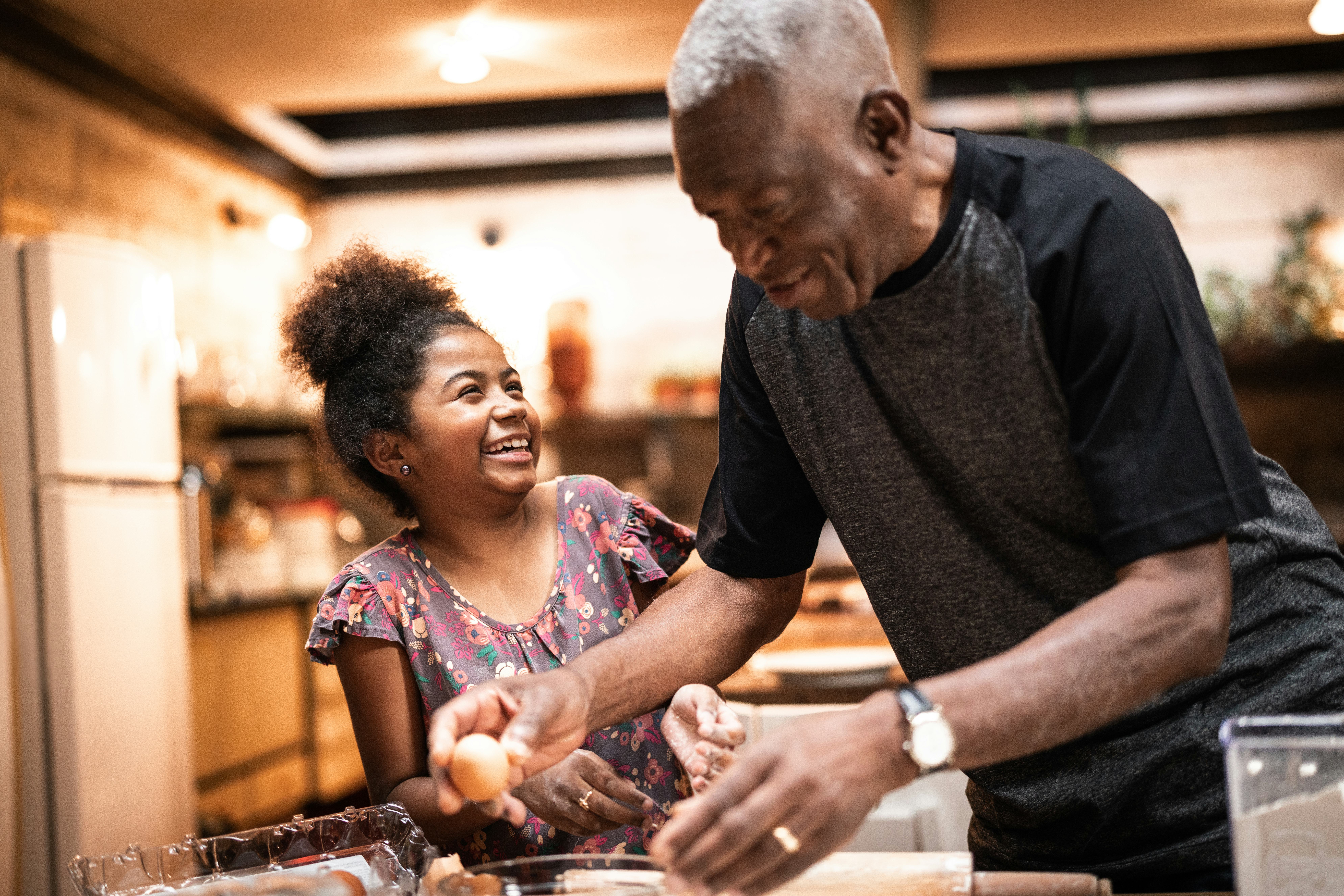 grandpa and granddaughter cooking