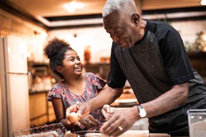 grandpa and granddaughter cooking
