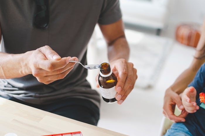 man pouring syrup into a spoon