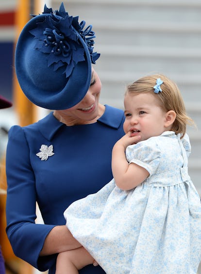 Princess Charlotte's hair is pinned back in a tiny bow