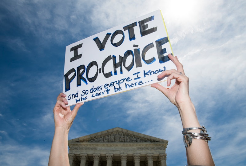 A woman holds a sign saying "I vote pro-choice." Tennessee’s 6-Week Abortion Ban Hurts Patients & Pr...