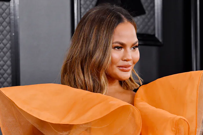 Chrissy Teigen visited the OB/Gyn in a face mask.
