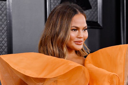 Chrissy Teigen visited the OB/Gyn in a face mask.
