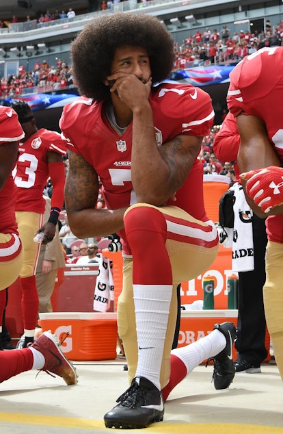  Colin Kaepernick kneels during an NFL game.