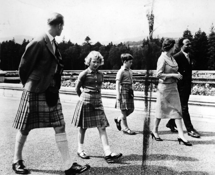Prince Philip matching kilts with daughter Princess Anne and Prince Charles.