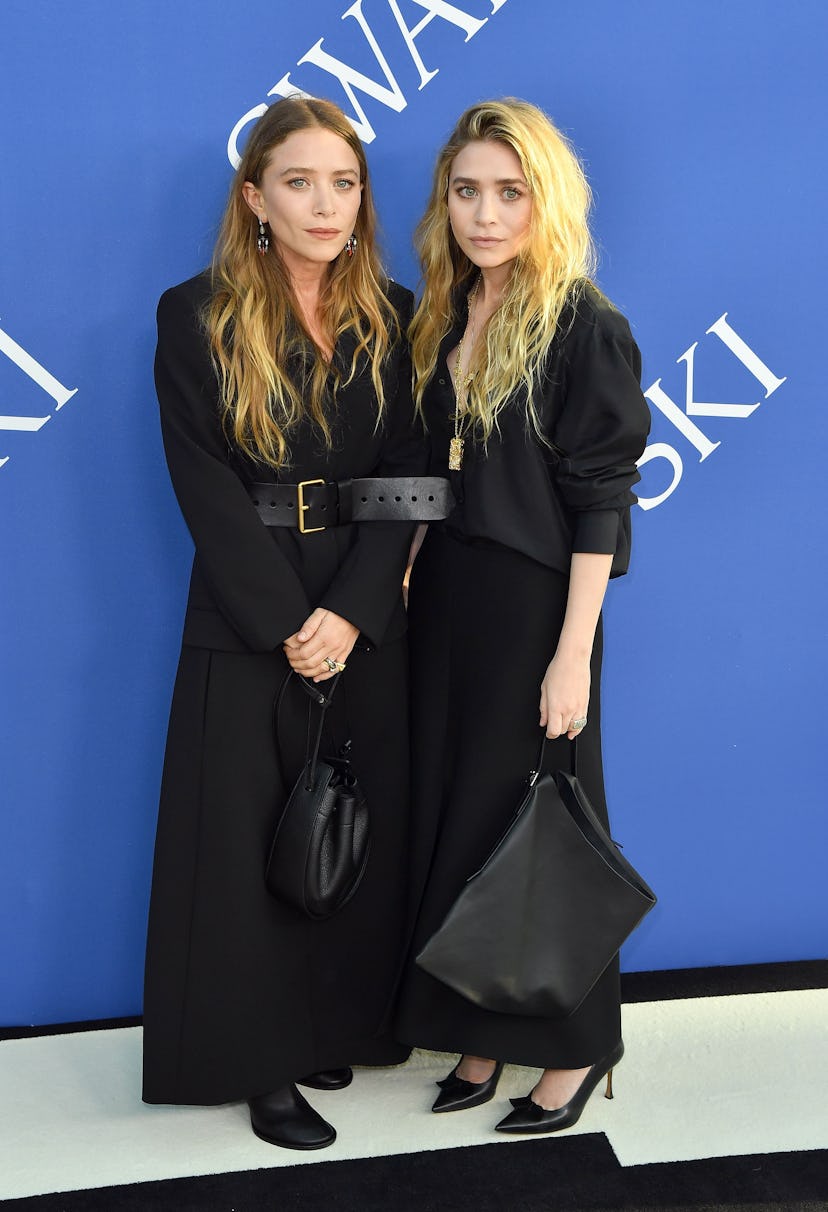 US fashion designer Mary-Kate Olsen (L) and Ashley Olsen arrives at the 2018 CFDA Fashion awards Jun...