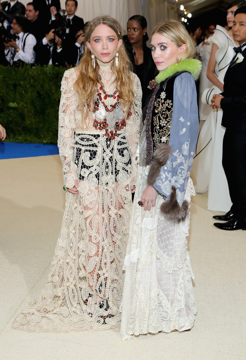 Mary-Kate Olsen (L) and Ashley Olsen attend the "Rei Kawakubo/Comme des Garcons: Art Of The In-Betwe...