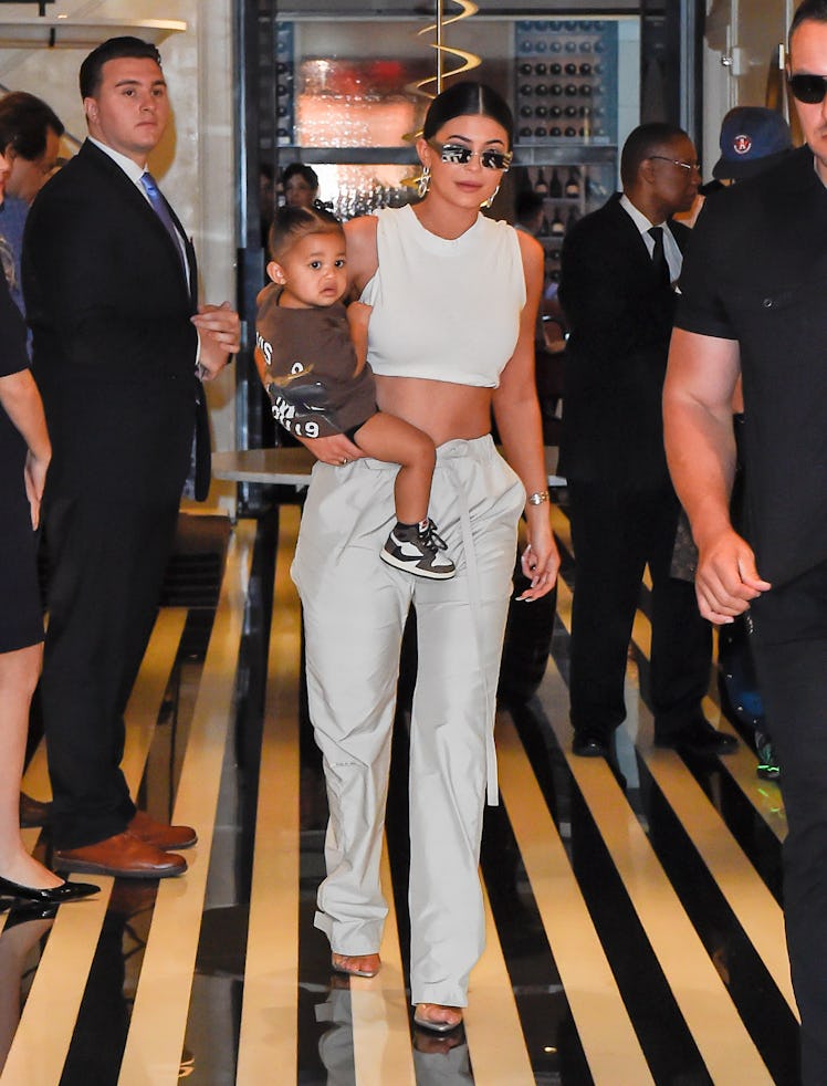 Kylie Jenner steps out with daughter Stormi.