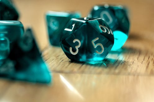 A set of teal die. Women explain how lockdown helped them get into role-playing games like dungeons ...