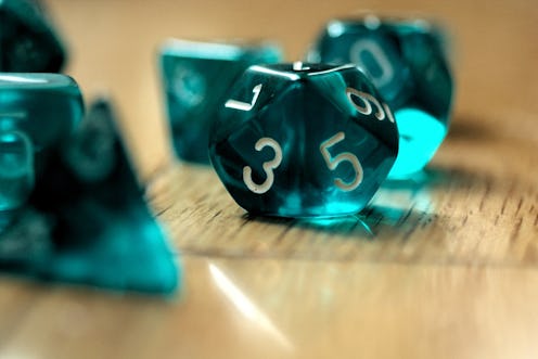 A set of teal die. Women explain how lockdown helped them get into role-playing games like dungeons ...