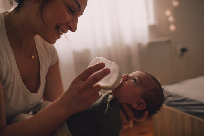 mom feeding infant with bottle