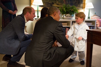 Prince George keeps it casual in a robe to meet President Obama.
