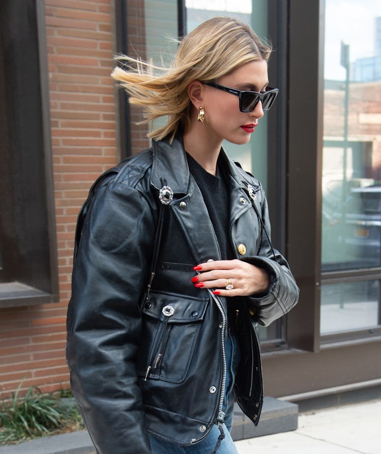 Hailey Baldwin steps out in a chic leather jacket.