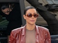 Kim Kardashian steps out with her sister Kourtney.