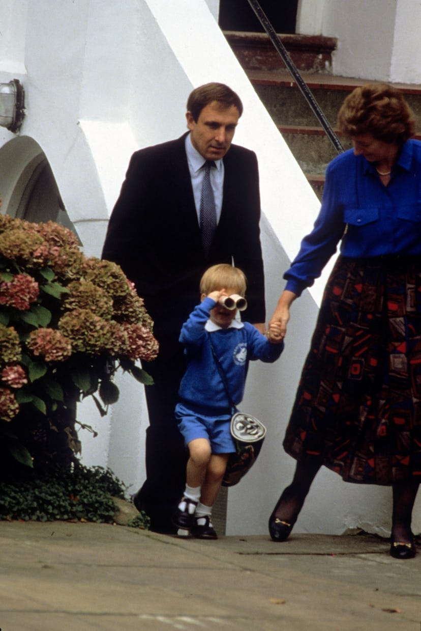 Prince Harry plays as he leaves nursery school 