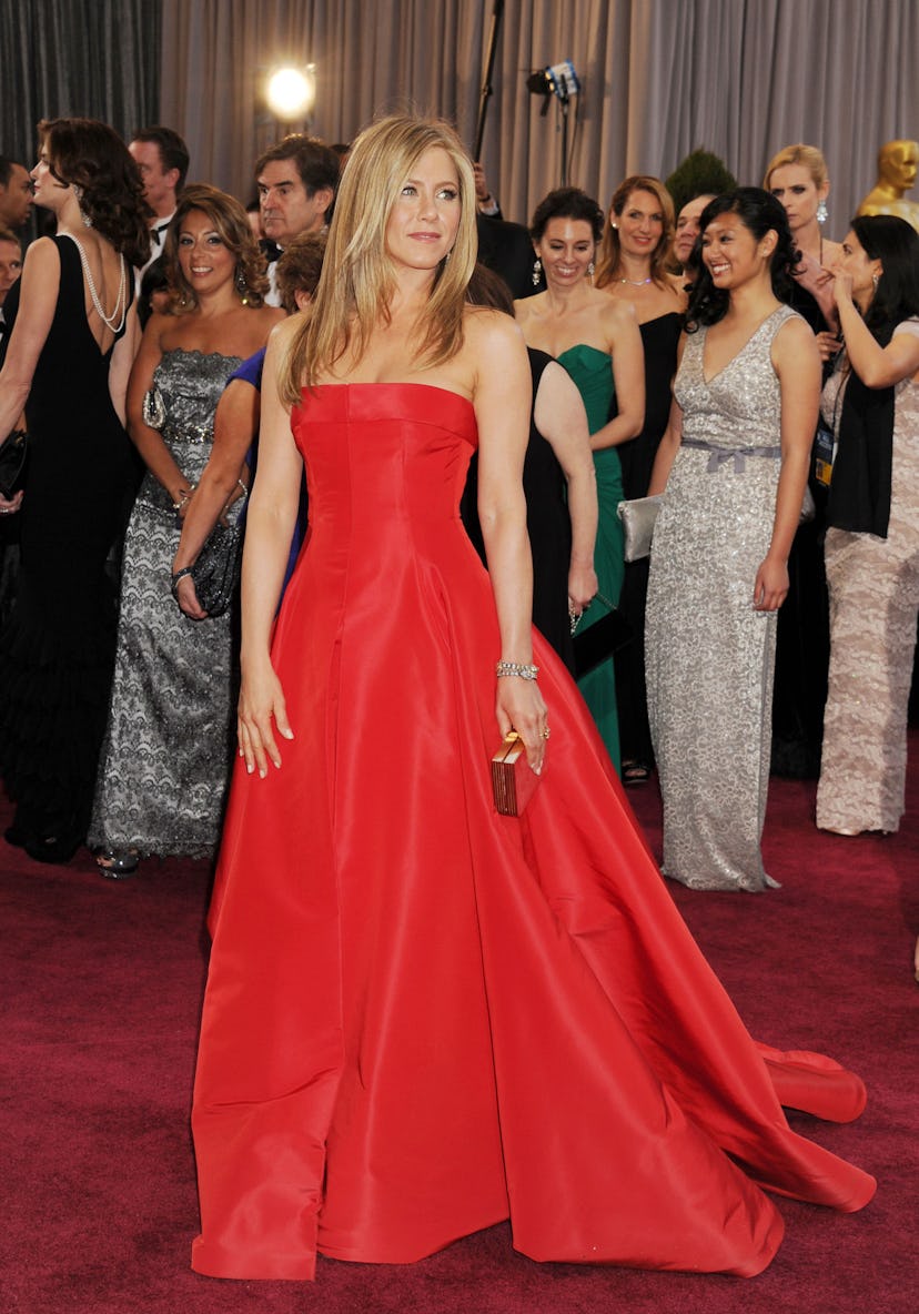 Jennifer Aniston wearing a red custom made Dior dress at the 2013 Academy Awards. 