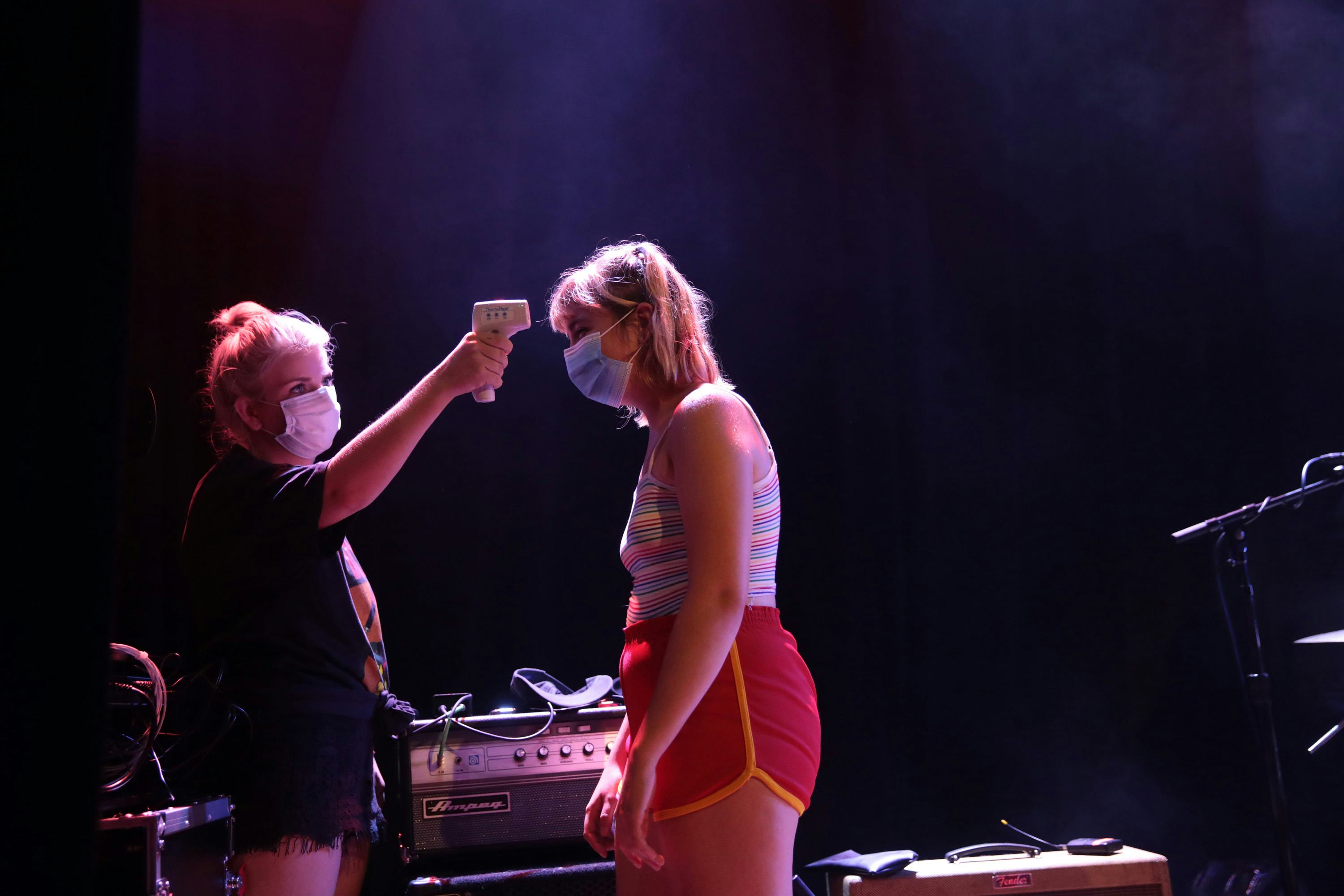 Production manager Emily Egerton takes the temperature of Lili Trifilio of Beach Bunny at Lincoln Ha...