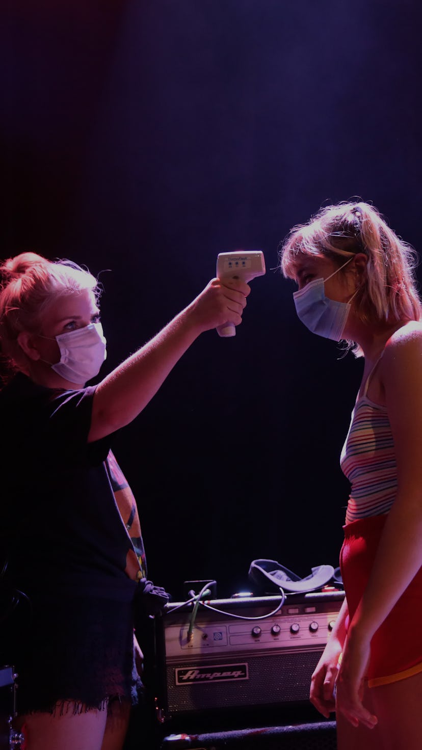 Production manager Emily Egerton takes the temperature of Lili Trifilio of Beach Bunny at Lincoln Ha...