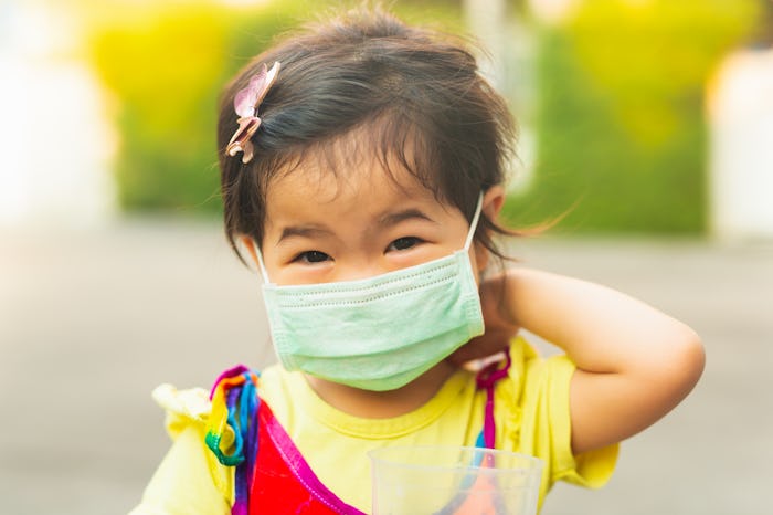 little girl wearing face mask