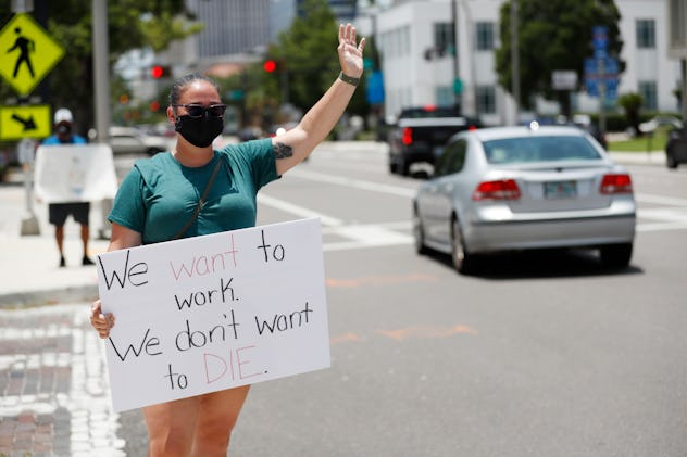 One teacher noted in her sign that she is fine to work, just not to die.