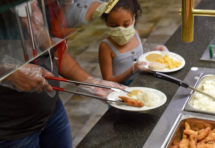 little girl at buffet in restaurant, coronavirus