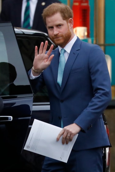 Prince Harry waves to fans.