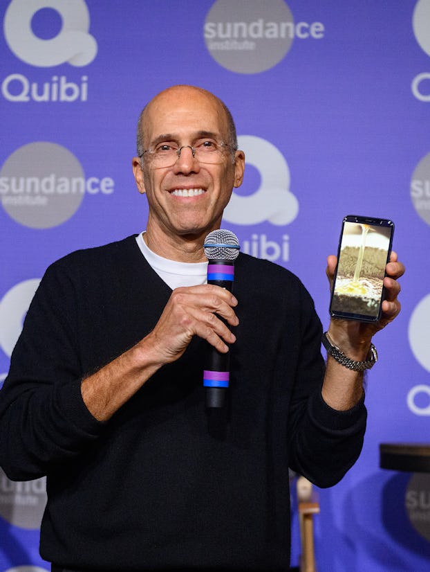 Jeffrey Katzenberg holding up a phone running Quibi.