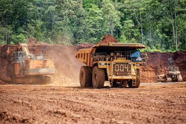 Heavy trucks working at a nickel mine in Indonesia in 2019.