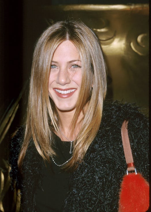 A red lip and understated eye makeup were one of Aniston's most iconic looks.