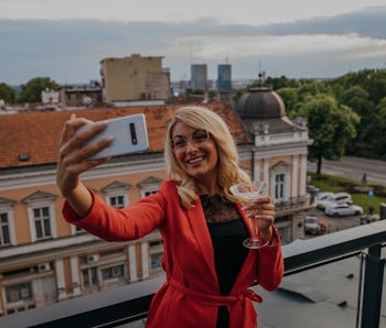 Woman taking a selfie.