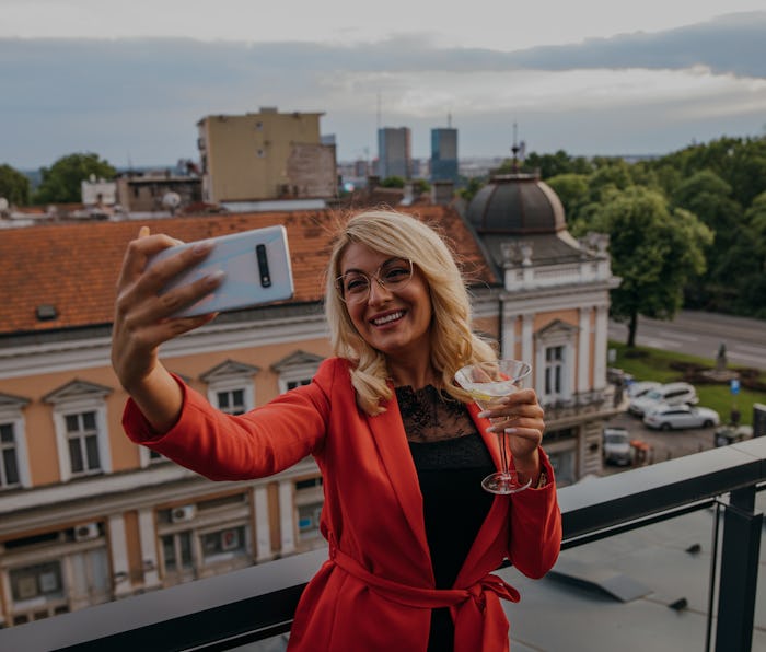 Woman taking a selfie.