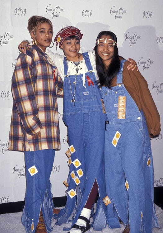 The members of the group TLC, sporting outfits with denim; blue denim jeans and denim overalls on a ...