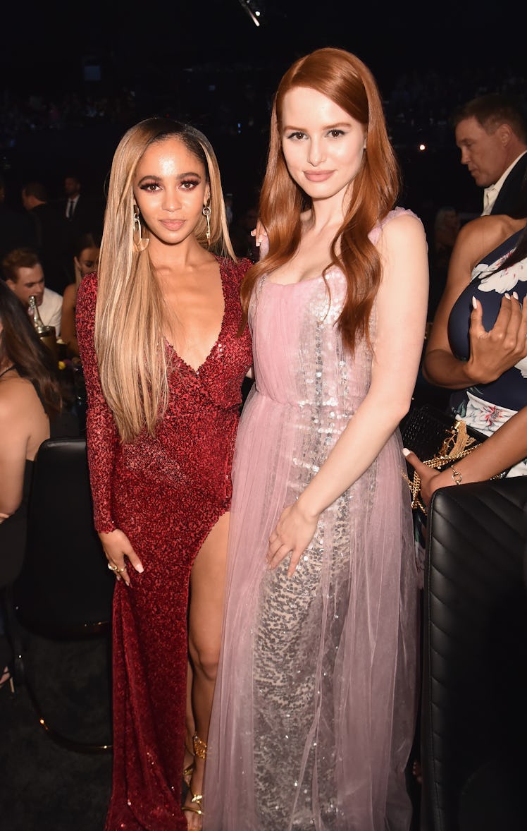 Vanessa Morgan and Madelaine Petsch twin in sequin gowns.