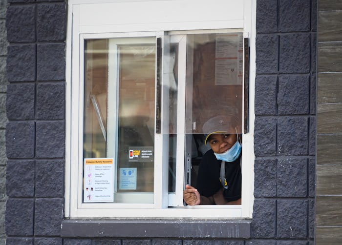 mcdonald's employee wearing mask takeout window