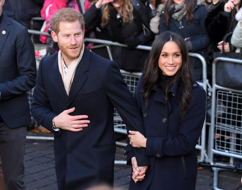 Meghan Markle holds her brand new fiance's hand as they attend a royal event.