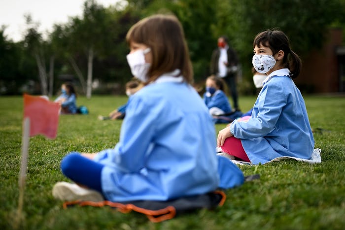 kids in outdoor learning class with face masks