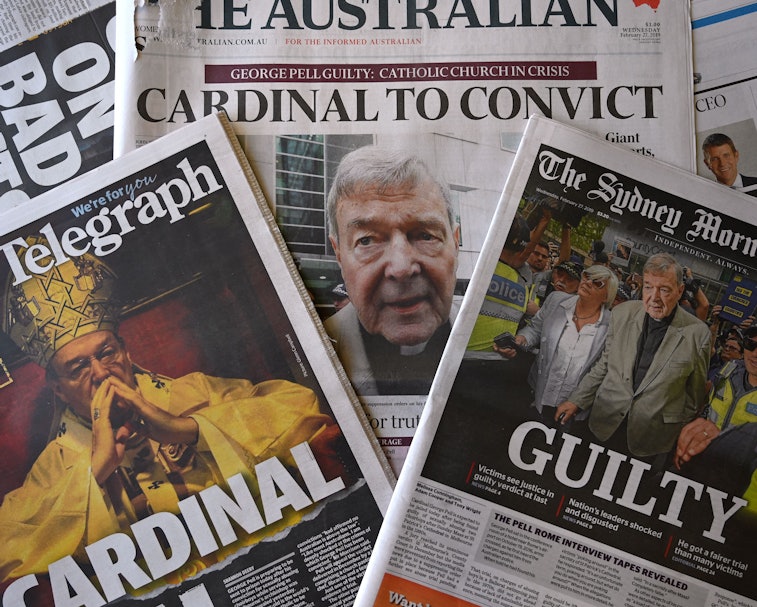A stack of Australian newspapers can be seen on top of each other, including The Australian, The Syd...