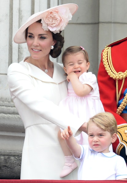 Kate MIddleton Holding Princess Charlotte, dressed in pink 