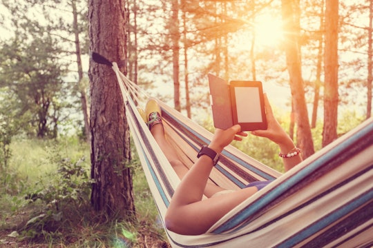 woman in hammock with e-reader 